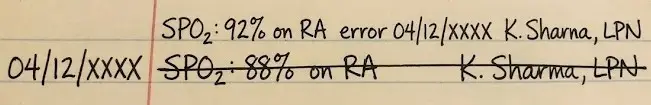Handwritten correction on a medical record