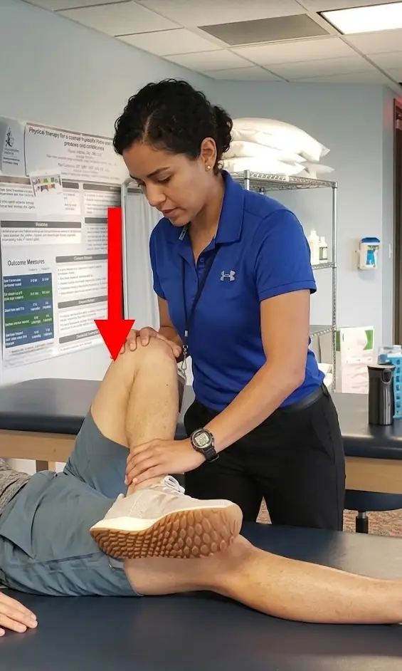 Clinician performing the Patrick FABER test on a patient’s hip and leg.