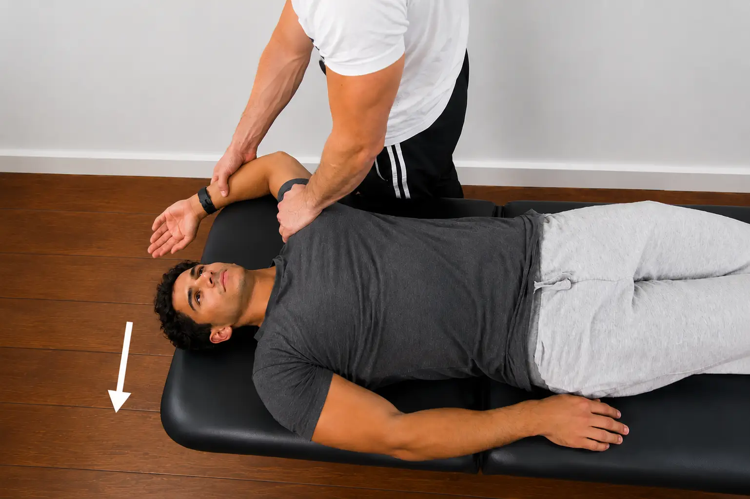 Upper limb tension test 2a showing median nerve bias with shoulder depression and abduction, elbow extension, and forearm supination.