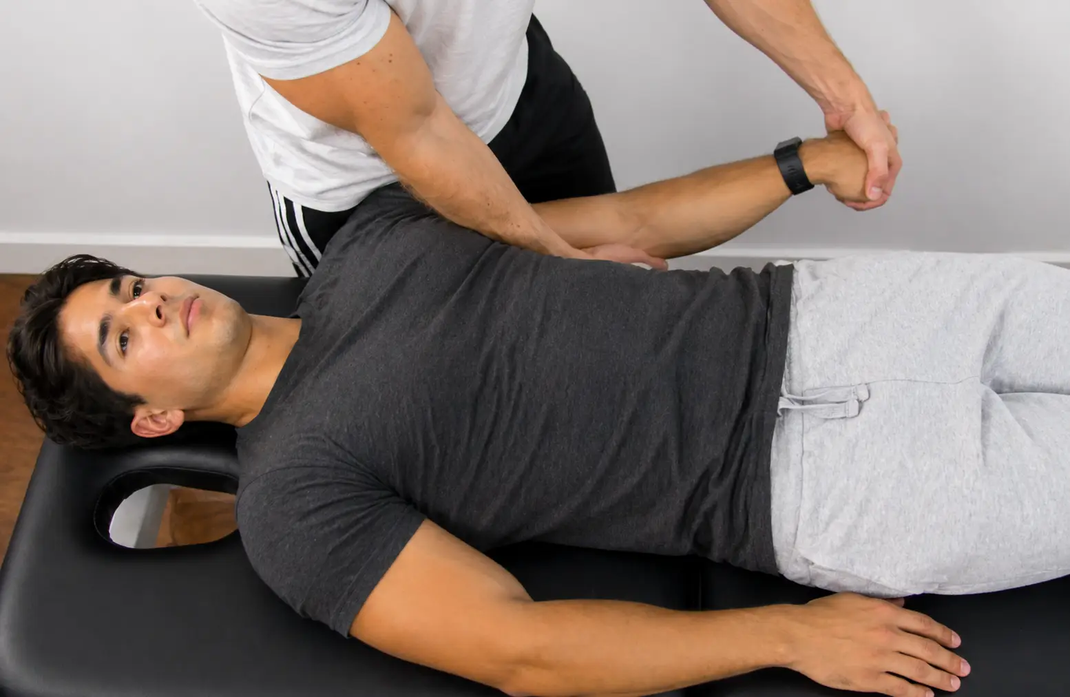 Upper limb tension test 2b demonstrating radial nerve bias with shoulder depression, elbow extension, and forearm pronation.